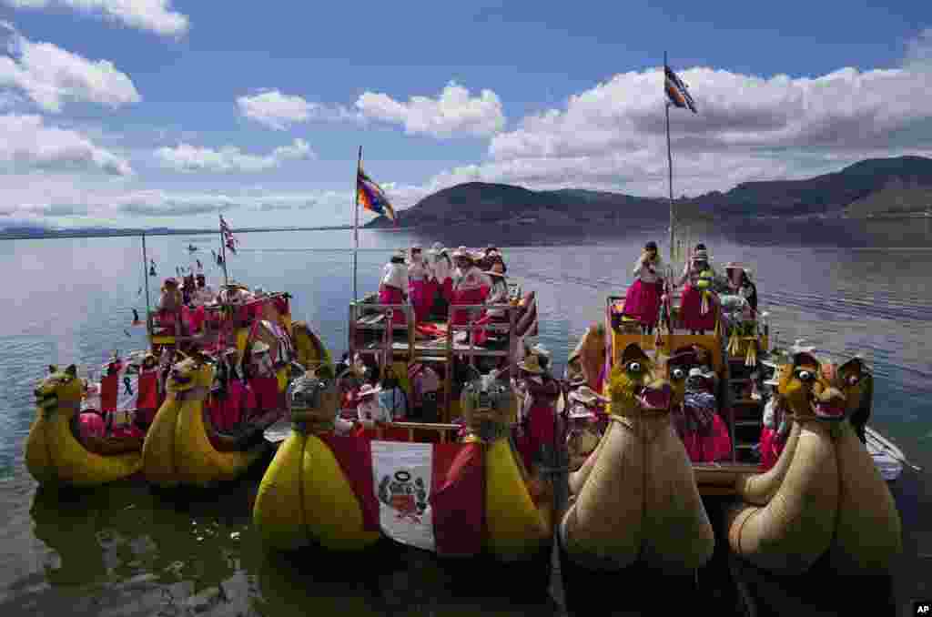 Aymara Indigenous women arrive in boats on Lake Titicaca from the Uros floating islands to attend a march marking International Women&#39;s Day in to Puno, Peru.