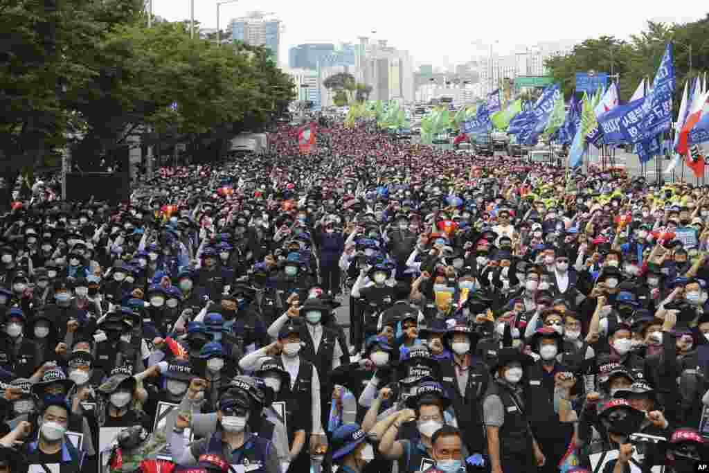 Workers wearing face masks to help protect against the spread of the new coronavirus stage a rally against the government&#39;s labor policy in Seoul, South Korea.