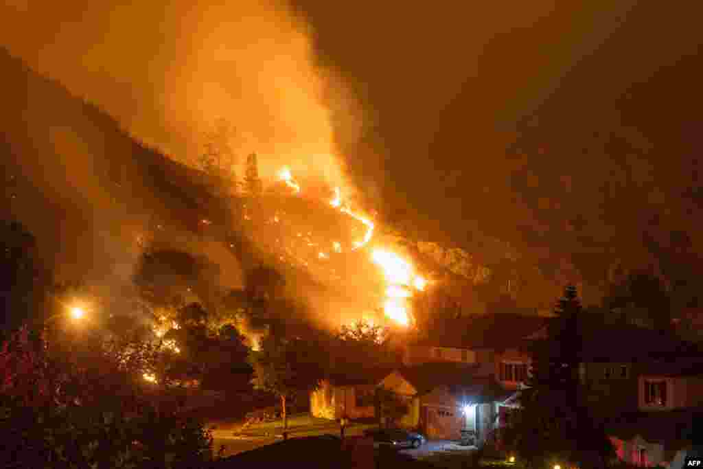 Flames from the Ranch Fire burn the hills in Azusa, California, 25 miles (40kms) east of Los Angeles.