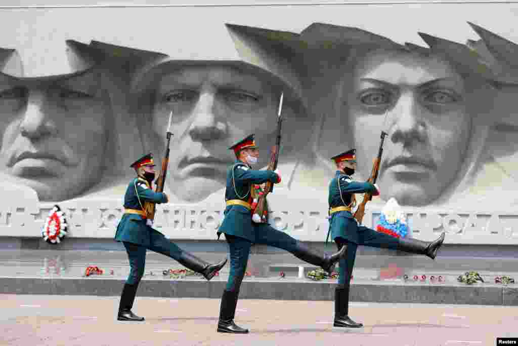 Honor guards march near a World War II monument in Stavropol, Russia, on the anniversary of the beginning of the Great Patriotic War against Nazi Germany in 1941.