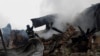 Firefighters work at the site of residential buildings hit by a Russian drone strike in Kharkiv, Ukraine, Dec. 25, 2024.