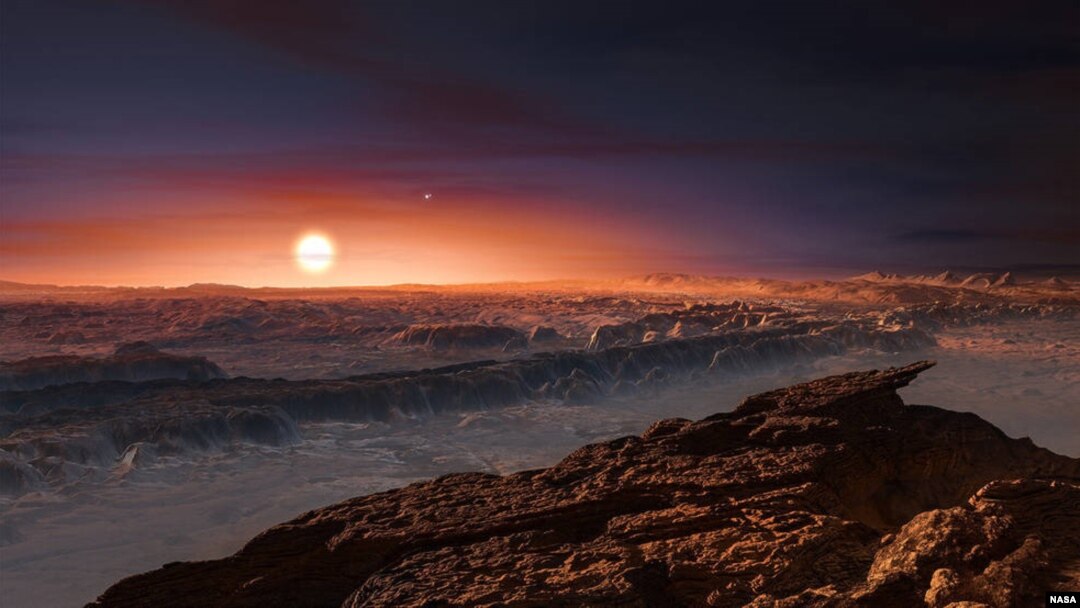 This artist’s impression shows a view of the surface of the planet Proxima b orbiting the star Proxima Centauri, the closest star to the solar system. (Credit NASA)