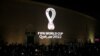 FILE - The tournament's official logo for the 2022 Qatar World Cup is seen on the wall of an amphitheater, in Doha, Qatar, Sept. 3, 2019.