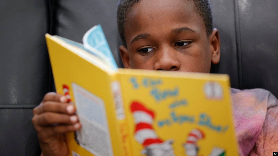 Michael Crowder, 11, reads during an after-school literacy program in Atlanta on Thursday, April 6, 2023. (AP Photo/Alex Slitz)