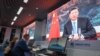屏幕上显示中国国家主席习近平通过视频在2020年11月4日在上海的媒体中心发表讲话。