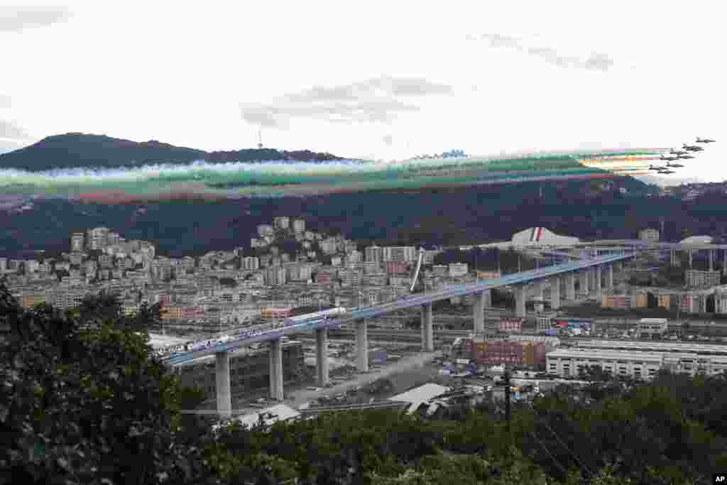 The Frecce Tricolore (Three-color Arrows) Italian Air Force aerobatic squad flies over the new San Giorgio Bridge during its inauguration in Genoa, Italy.&nbsp;Two years ago, a stretch of roadbed collapsed on Genoa&#39;s Morandi Bridge, sending cars and trucks plunging to dry riverbed below and ending 43 lives.