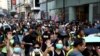 禁蒙面订立第一日10月5日香港民众戴口罩继续抗议。路透社
